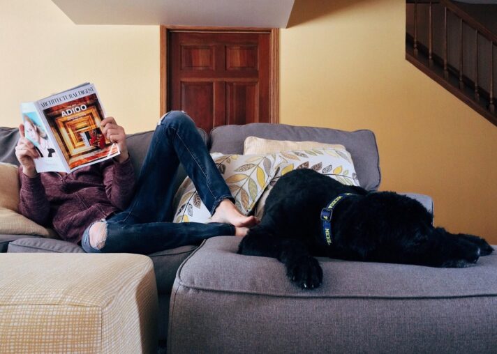 A person relaxes on the sofa